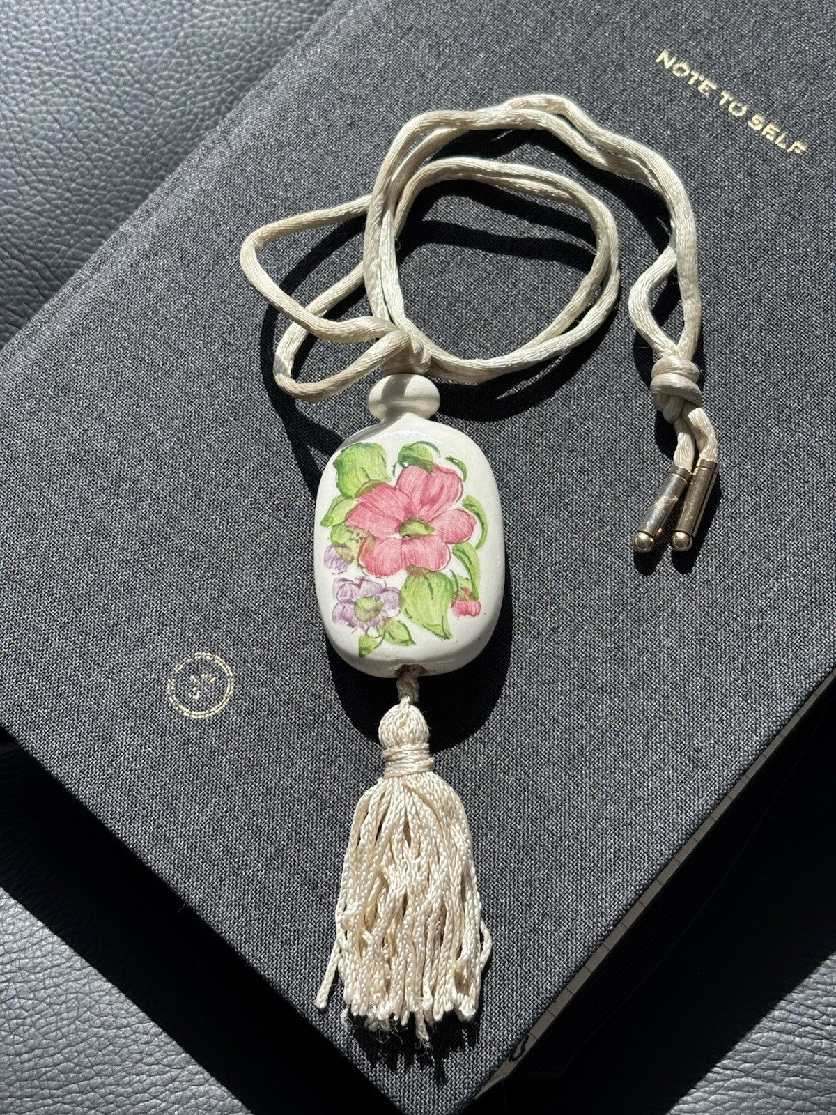 Vtg AVON Hand Painted Floral Ceramic Pendant Necklace W/Tassel & Silk Cord 1980
