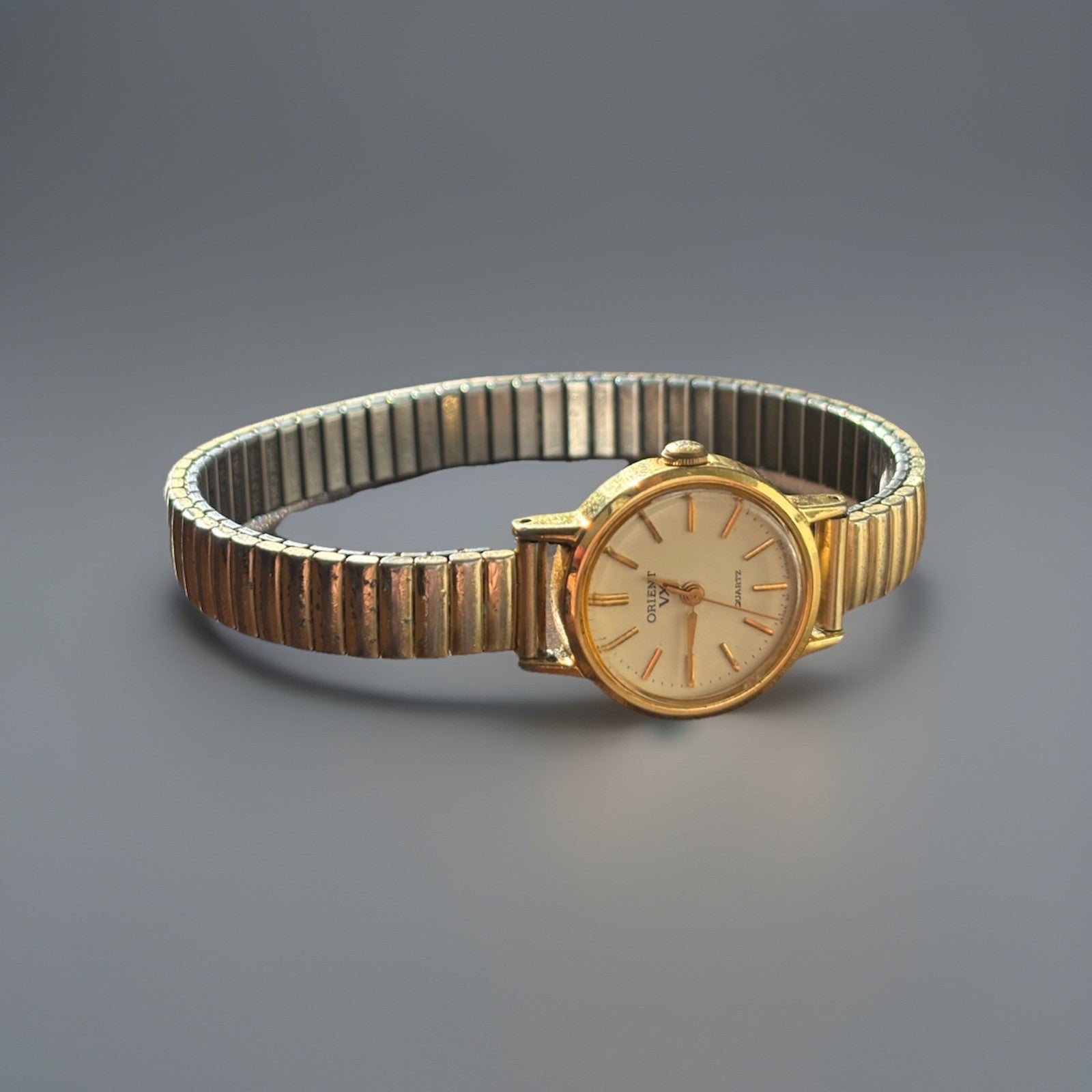 VINTAGE 1983 Orient VX Womens Watch Gold Tone Stretch Band Quartz Movement