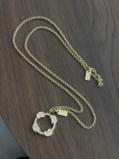 Cute Vintage COACH Gold Plated Pave Crystal Infinity Knot Pendant Necklace Long